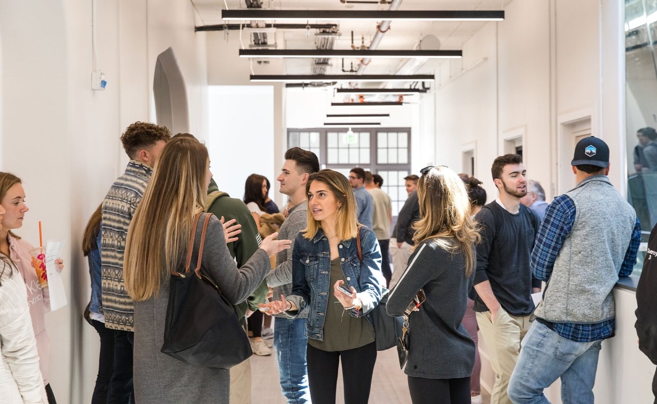 students talking at event