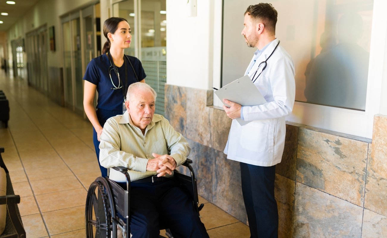 Nursing students with patient in hospital