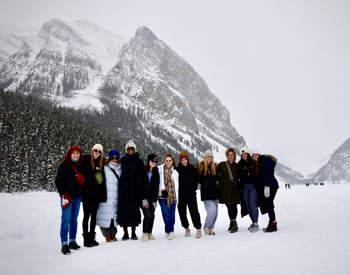 group posing in snowy landscape