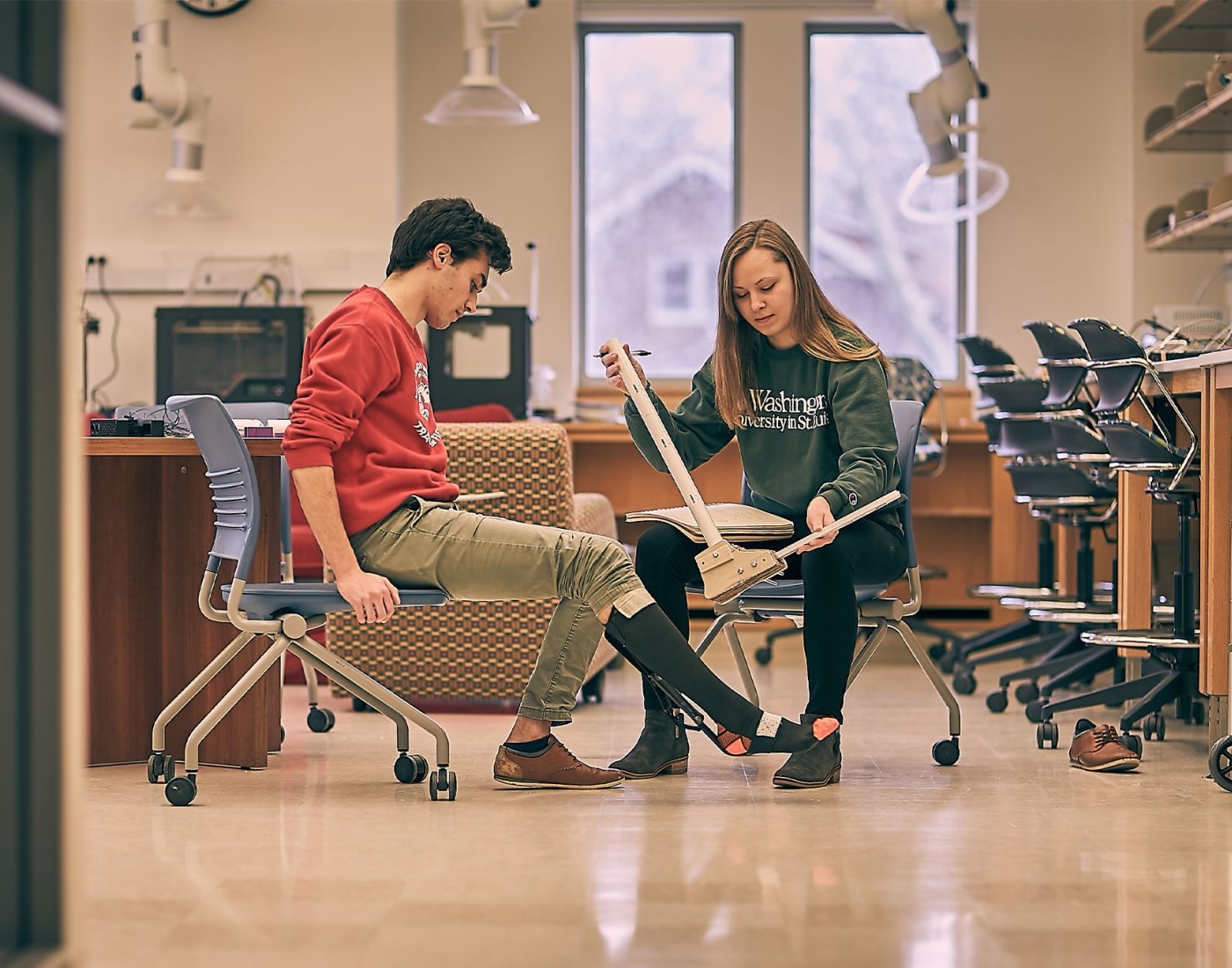 students measuring leg brace