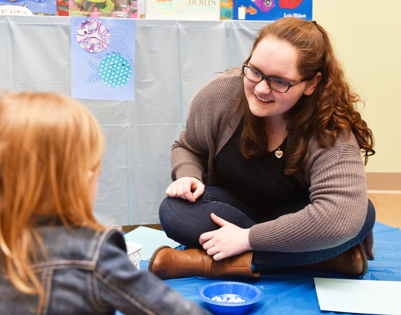 student working with child