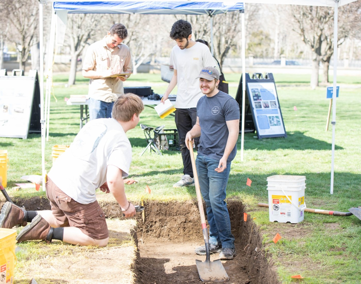 students working at archeological dig