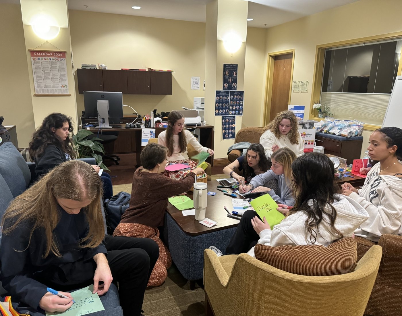 Mercy in Motion students write cards for veterans.