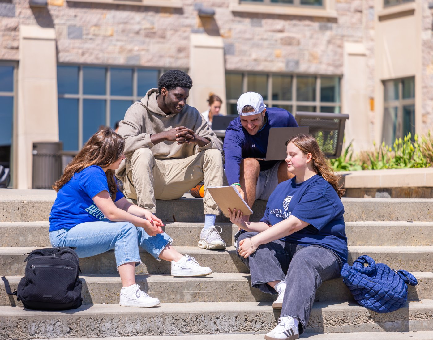 Students gather behind O'Hare Academic Building at Salve Regina University