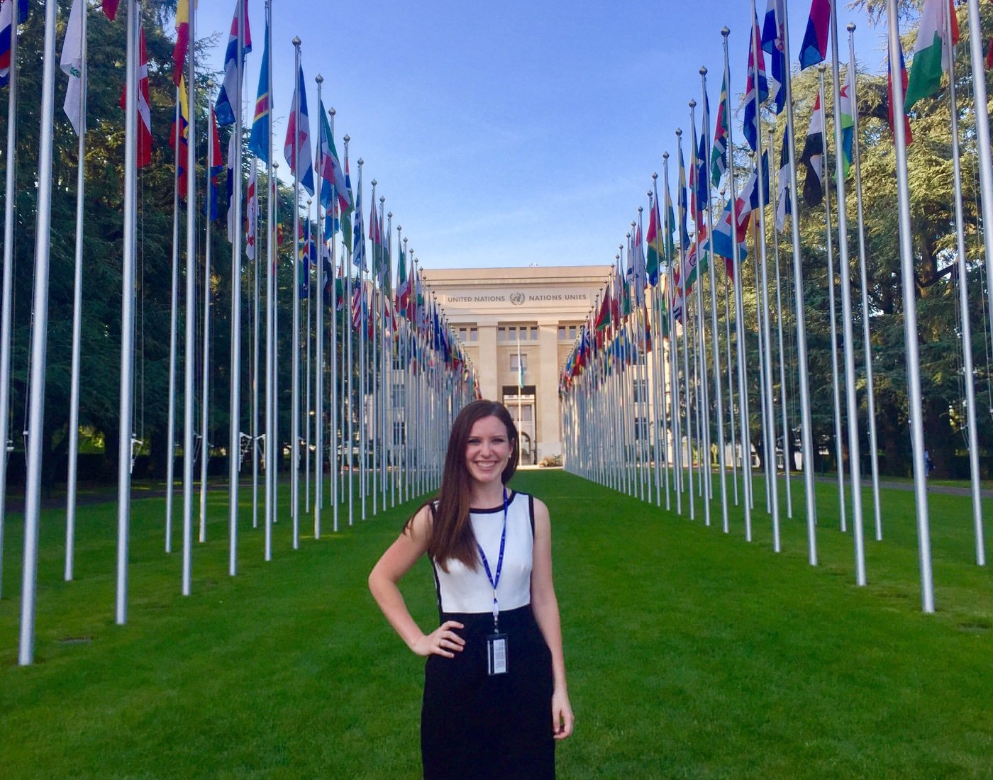 student infront of UN with flags