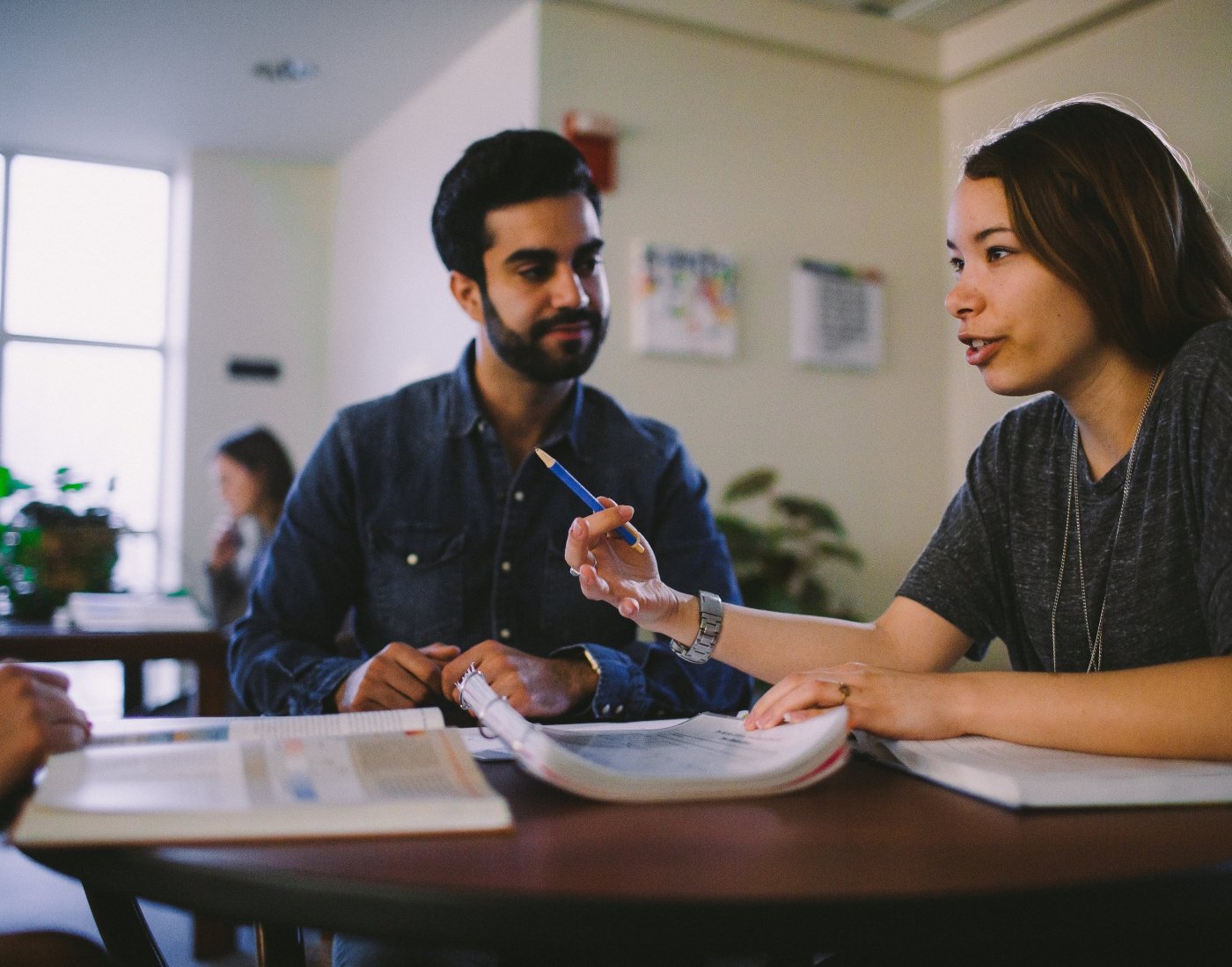 Student being tutored in university library