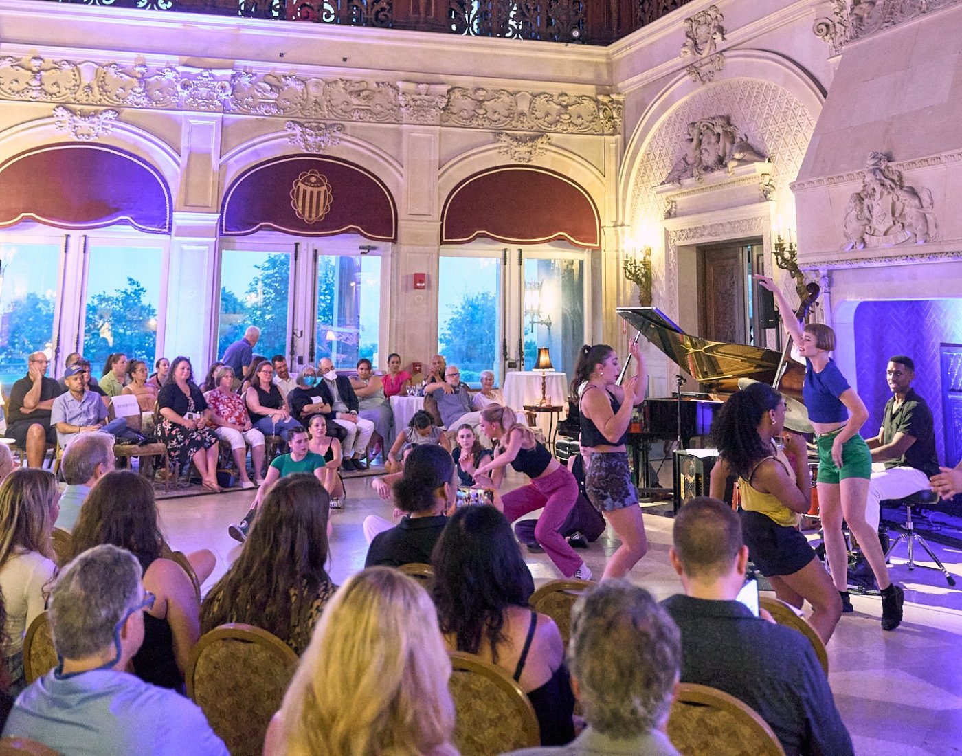 Musicians and dancers performing for an audience