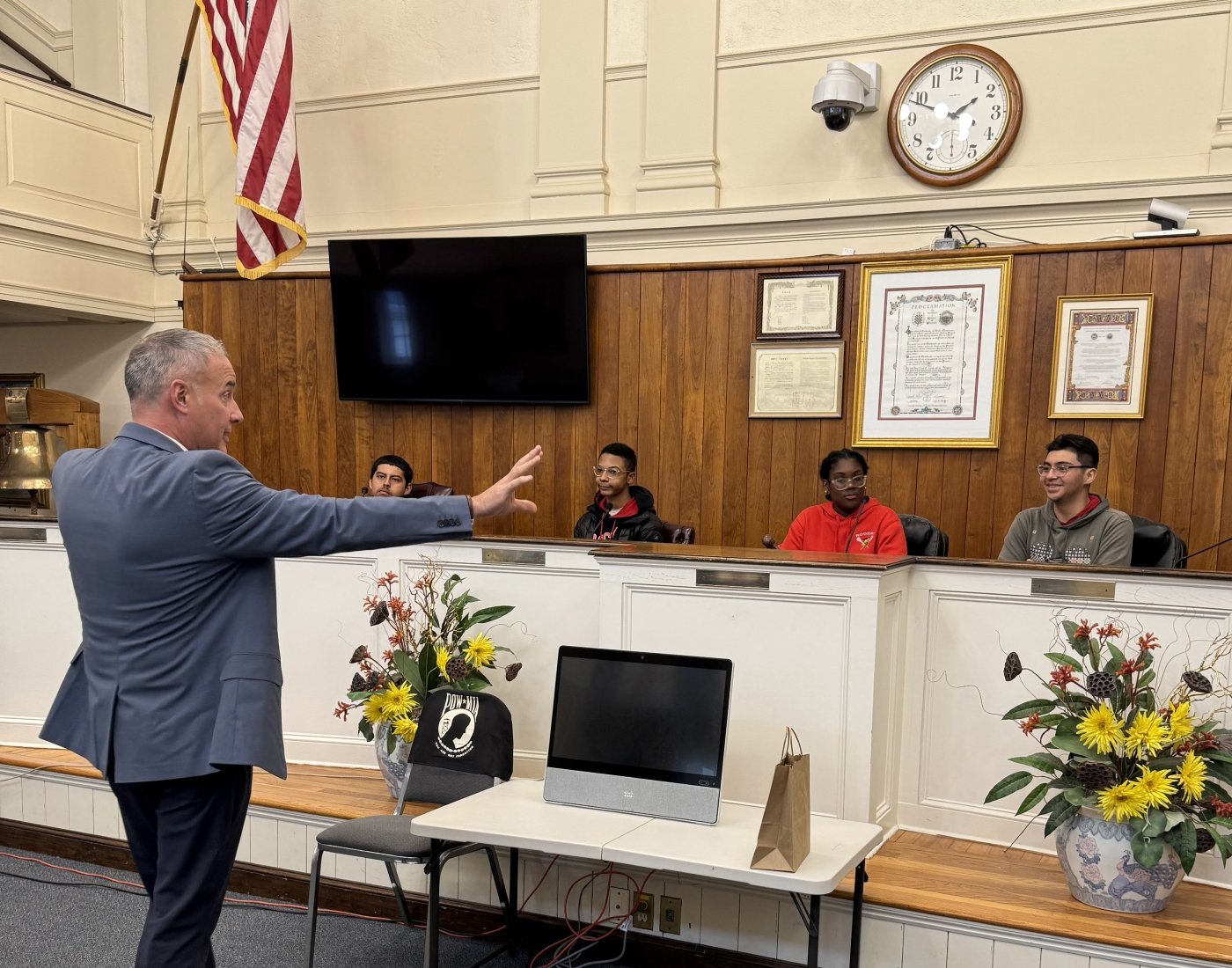 A man speaking to a group of students