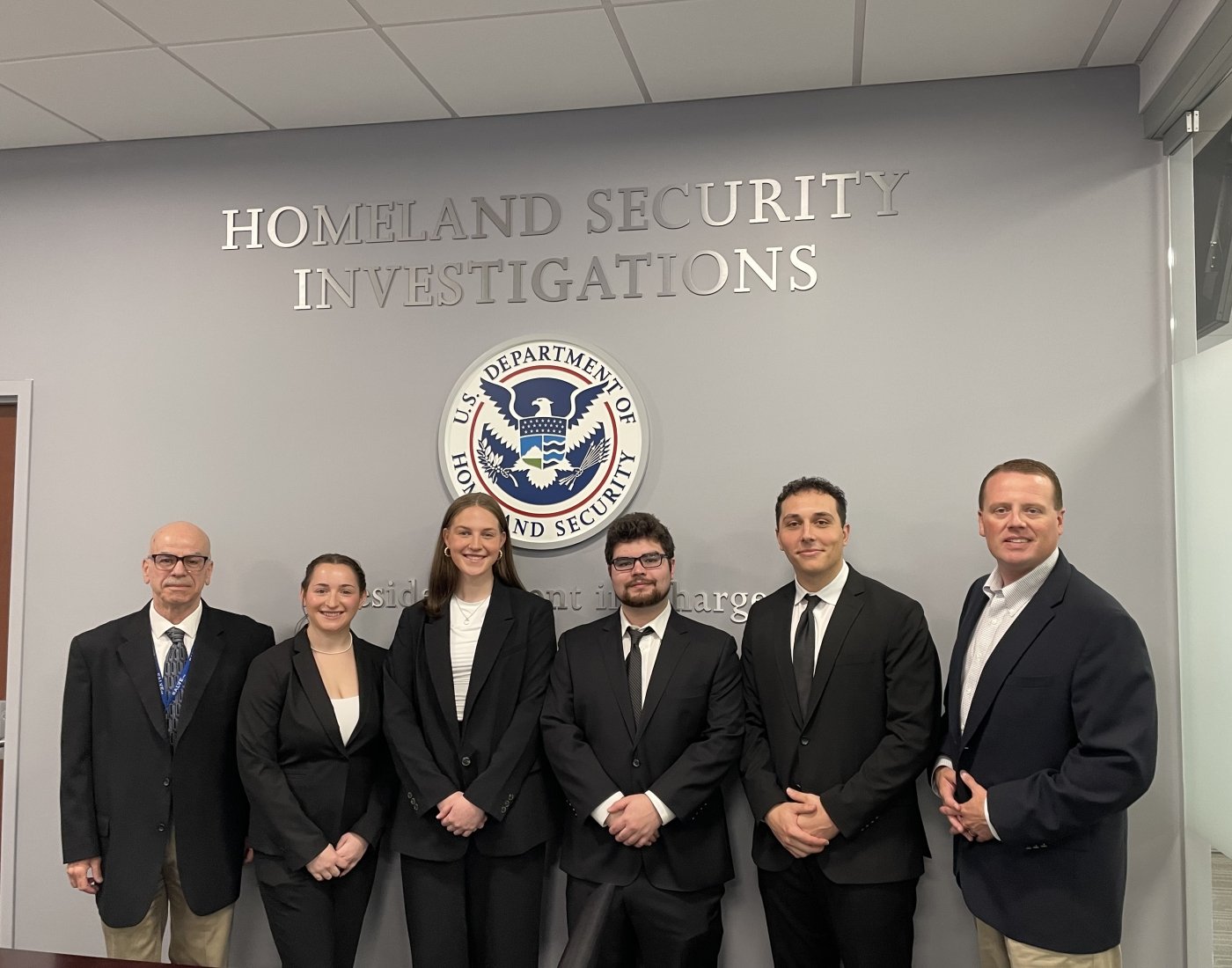 A group of people in business suits.