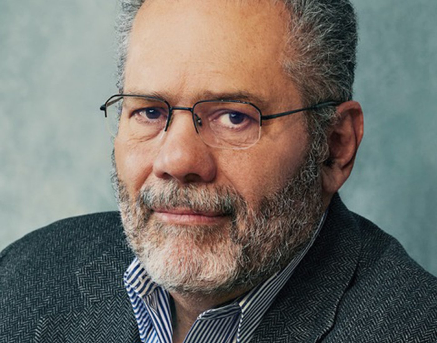 Professional headshot of Suarez