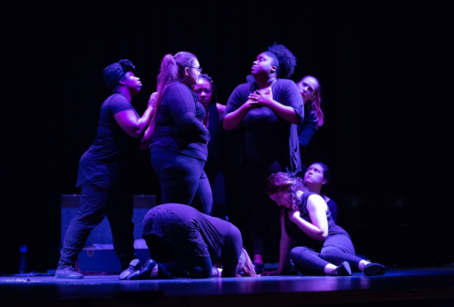 theater students in purple lighting
