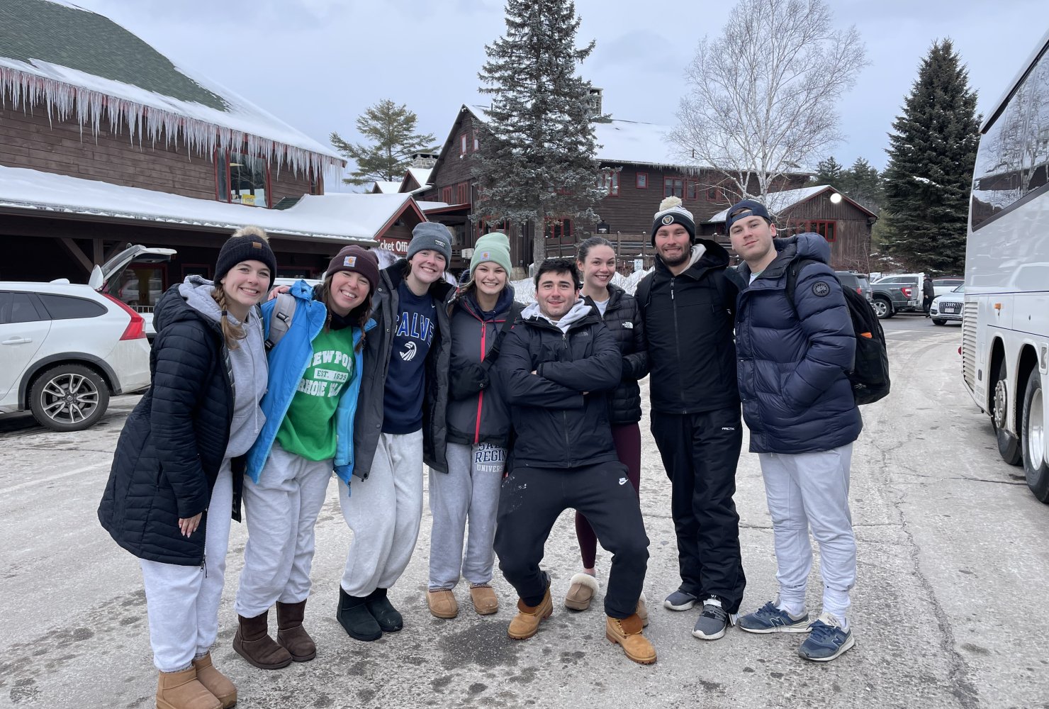 Group photo of Gracie and the Ski and Snowboarding Club at a ski resort.