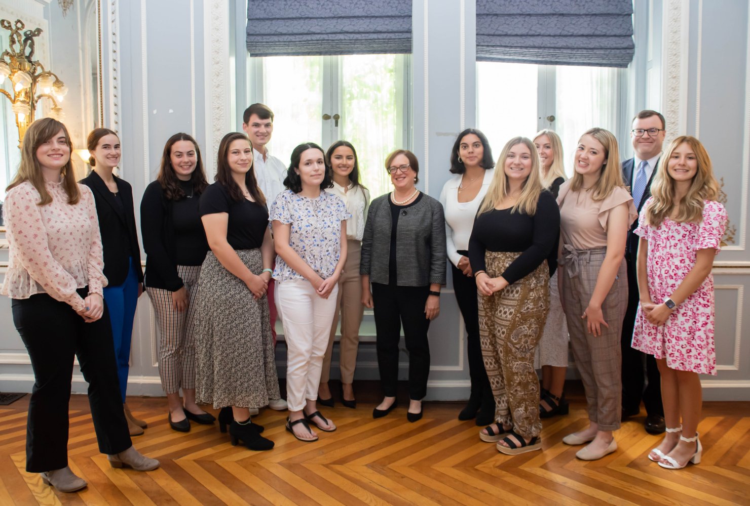 Students stand with Justice Elena Kagan