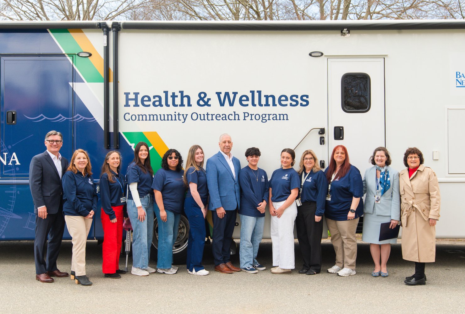 BankNewport, Harvard Pilgrim Health Care and Tufts Health Plan joining the Health and Wellness Community Outreach Program outside the mobile unit.