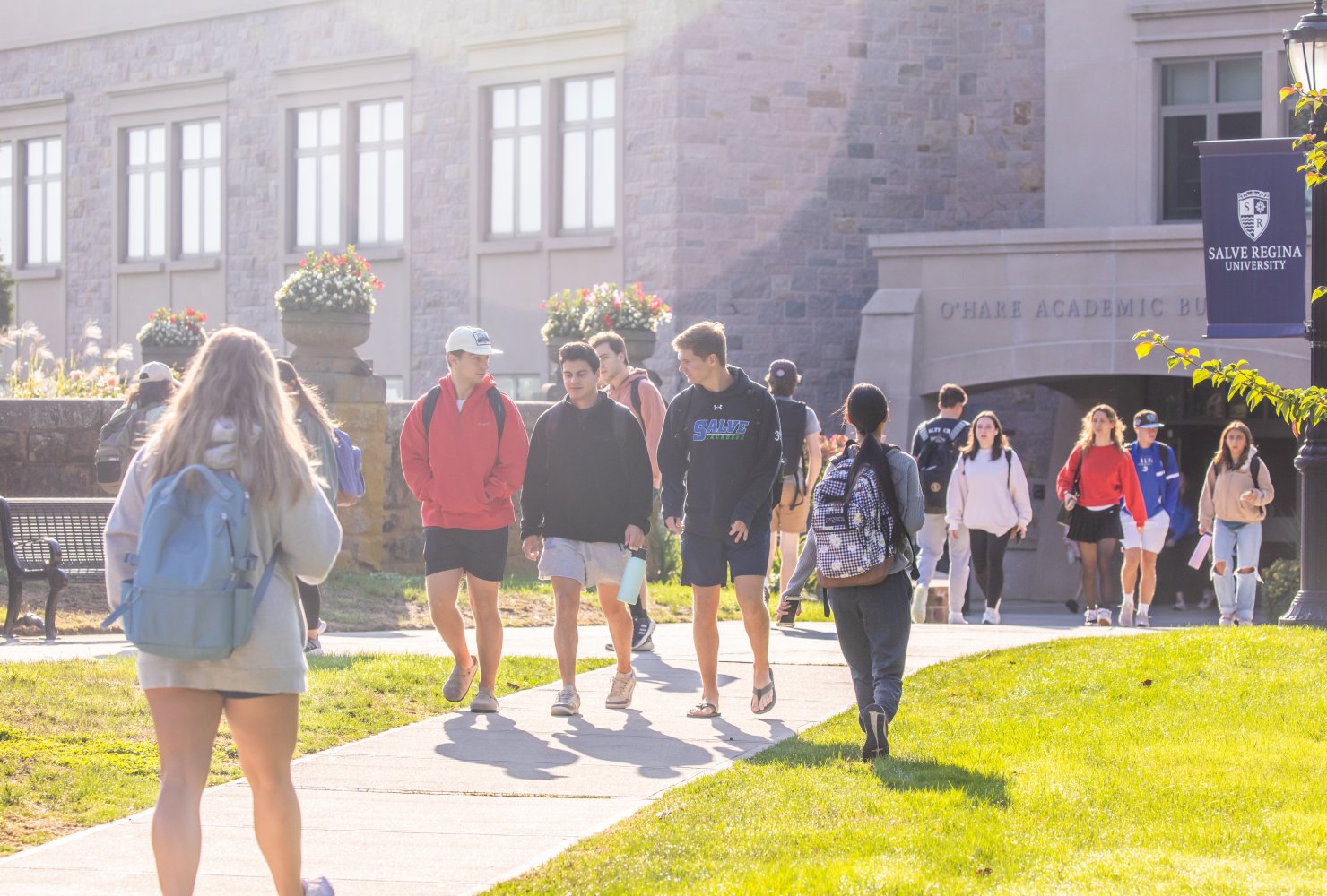Students walking in front of campus building.