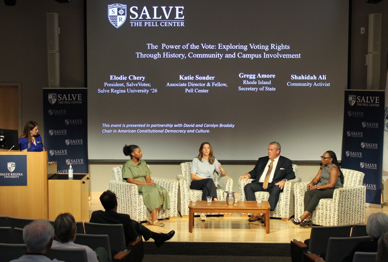 Panelists on stage at Pell Center event