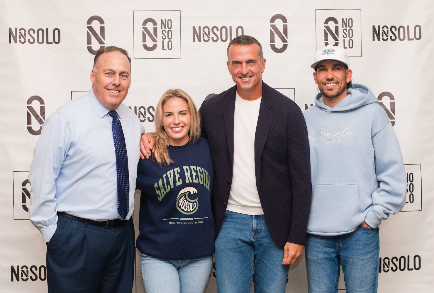 pro athlete, NOSOLO sponsors, AD group in front of step-and-repeat