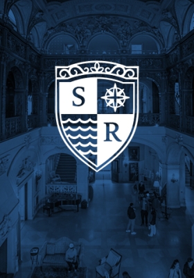 An image of the Salve Regina crest over a blue background.