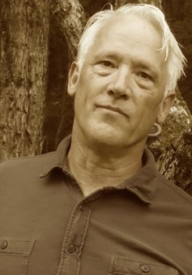 Sepia tone headshot of Tim Weed