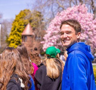 Student outdoors on campus in spring