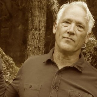 Sepia tone headshot of Tim Weed