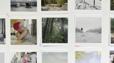 A collection of photographs hanging on a wall