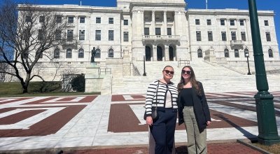 Two students standing outside of the RI State House
