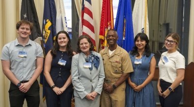 Salve Regina students with President Armstrong, Naval War College President Adm. Walker.