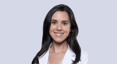 Professional headshot of Brown in her white lab coat.