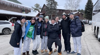Group photo of Gracie and the Ski and Snowboarding Club at a ski resort.