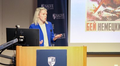 Erin Redihan gives lecture at podium
