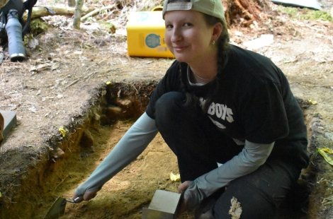 student working in dig site