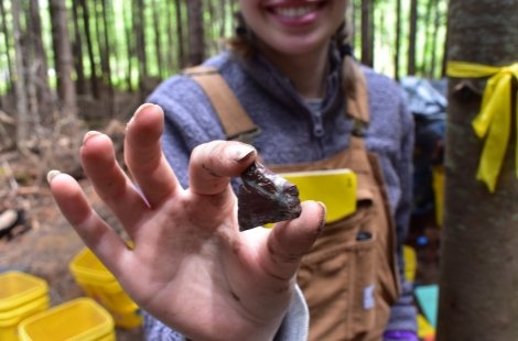 close up of student holding artifact