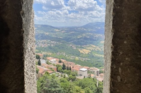 Looking through stone building window over San Marino, Italy