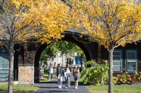 Students walk through the arch at Stonor and Drexel halls.