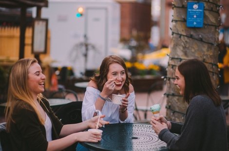 three students eating ice cream 