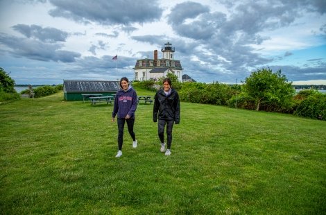 students walking by Rose Island lighthouse