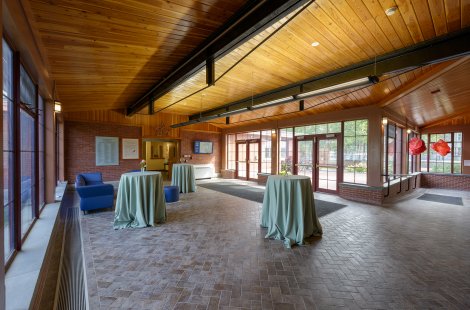 A large lobby area with cocktail tables.