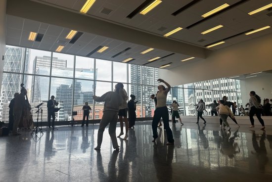 Salve students dancing jazz in Calgary in large room with big windows.