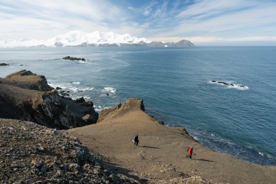 Dr. Jesse Casana (front) and Kitchel carrying survey equipment on Livingston Island.
