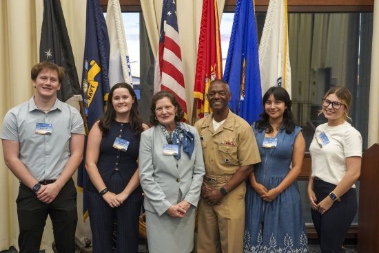 Salve Regina students with President Armstrong, Naval War College President Adm. Walker.