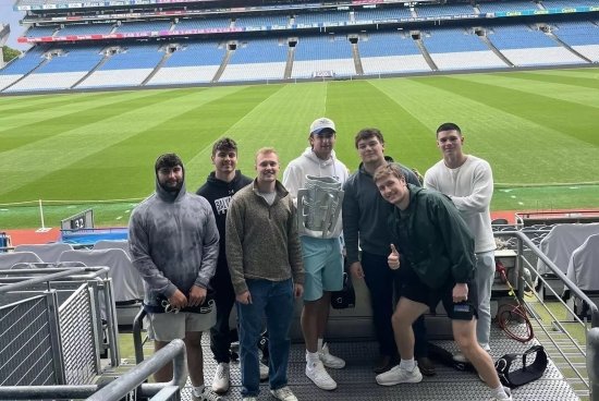 Students hold a replica of the MacCarthy Cup at Croke Park.