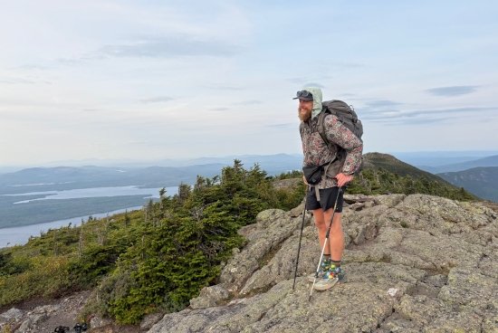 Crocker at the top of a mountain, hiking the Appalachian Trail.