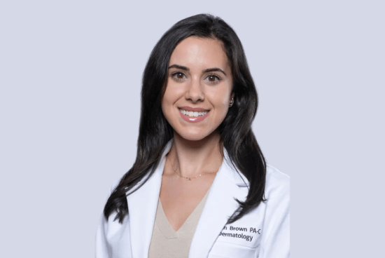 Professional headshot of Brown in her white lab coat.