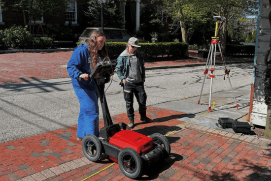 Dufresne using ground penetrating radar to conduct archaeological research in Rhode Island.