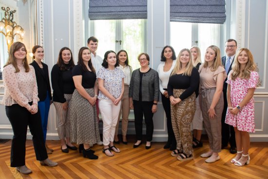 Students stand with Justice Elena Kagan