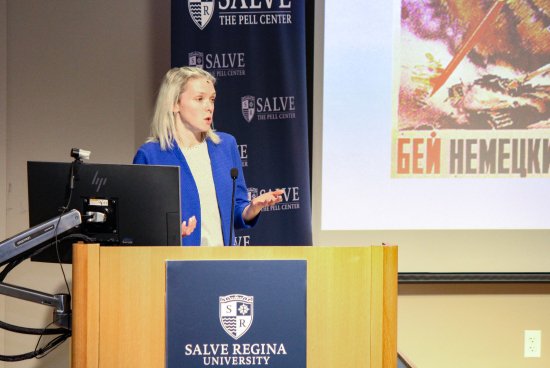 Erin Redihan gives lecture at podium