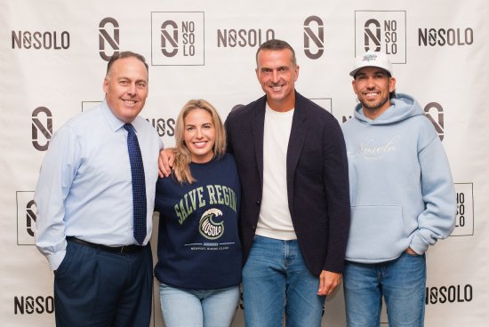 pro athlete, NOSOLO sponsors, AD group in front of step-and-repeat