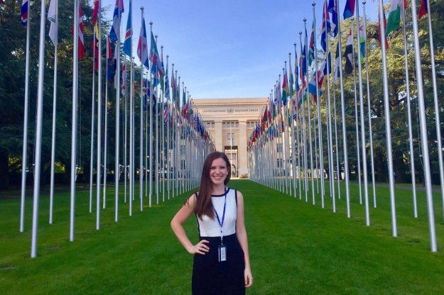student infront of UN with flags