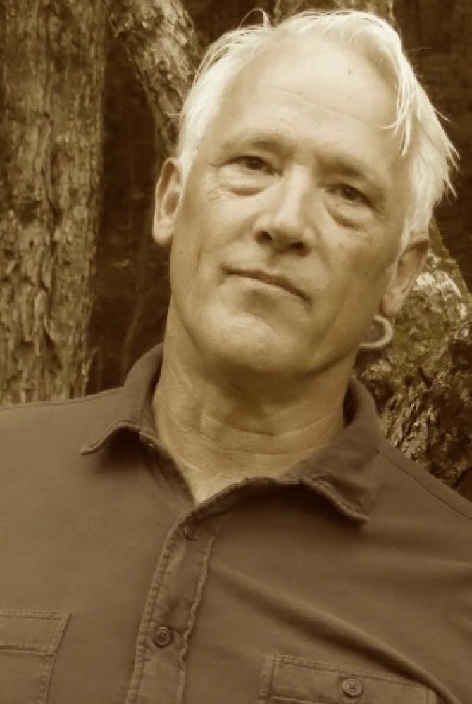 Sepia tone headshot of Tim Weed